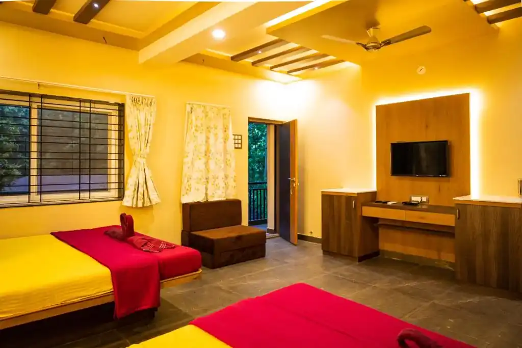 Large AC Family room accommodating 6-10 guests at Dew Drops Jungle Resort